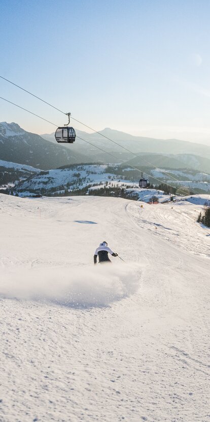 Abfahrt Skifahrer König Laurin Piste in Carezza | © Carezza Dolomites/Harald Wisthaler