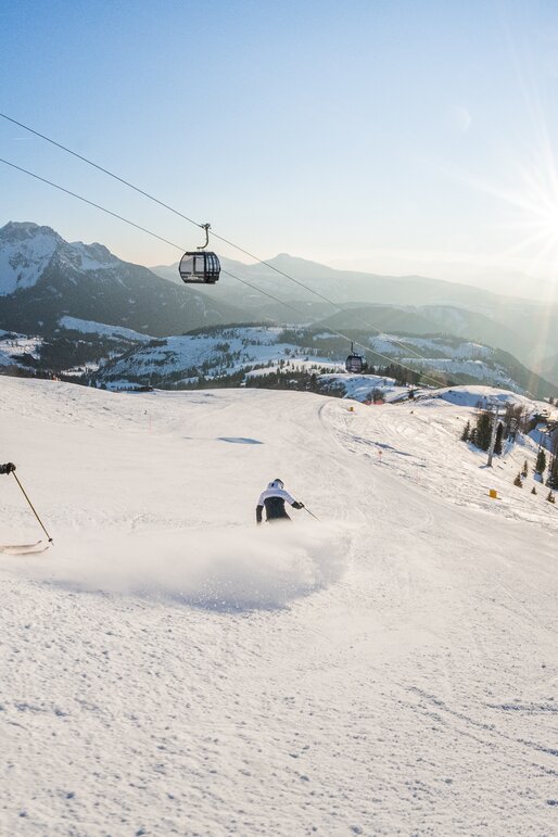 Sciatore in discesa pista Re Laurino di Carezza | © Carezza Dolomites/Harald Wisthaler