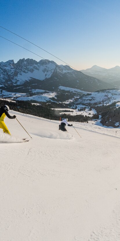 Skier Downhill King Laurin Slope View Latemar Sunset | © Carezza Dolomites/Harald Wisthaler